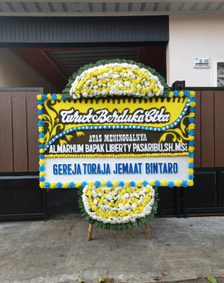 Papan Bunga Duka di Nikan Jaya